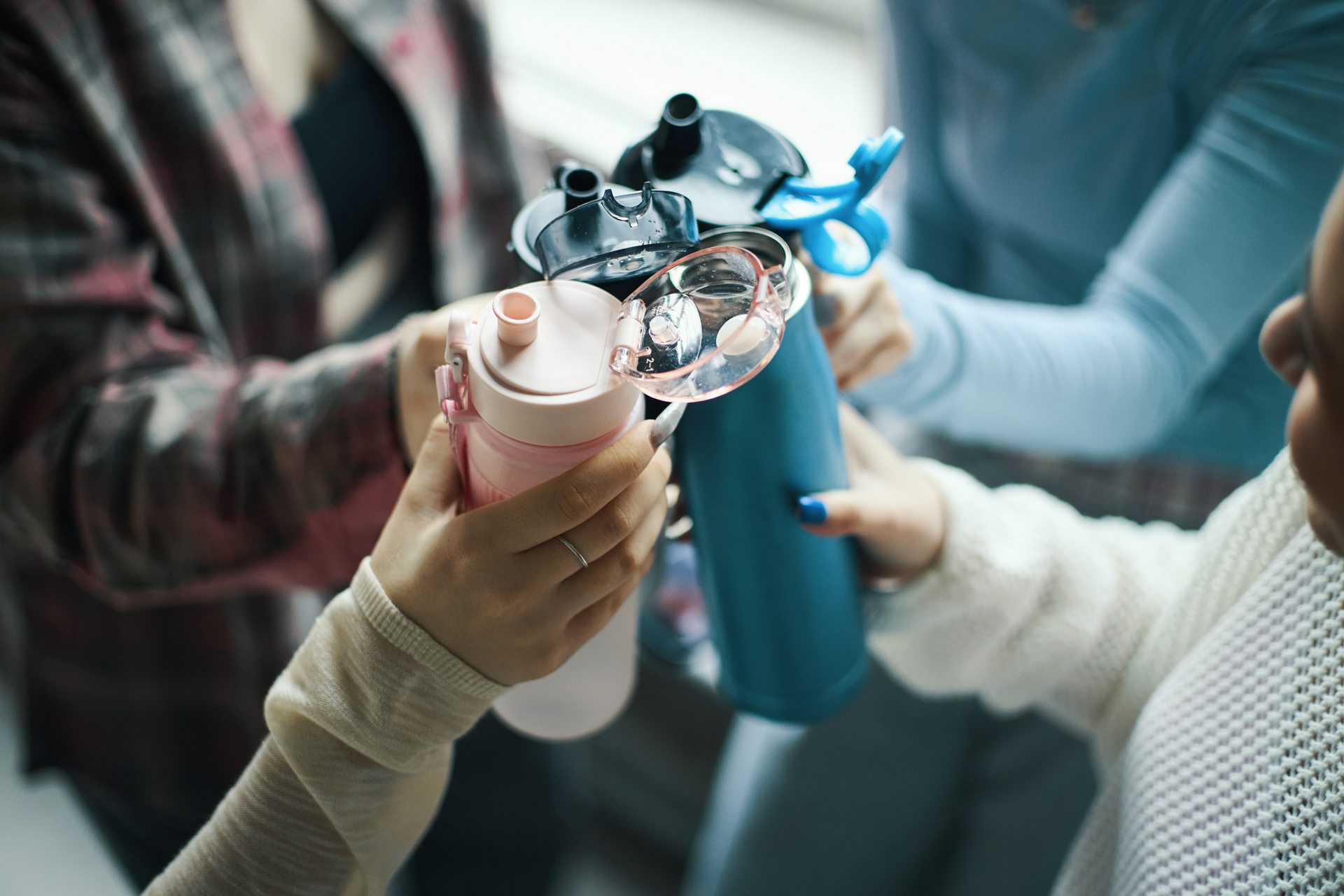 Group of young women with water bottles