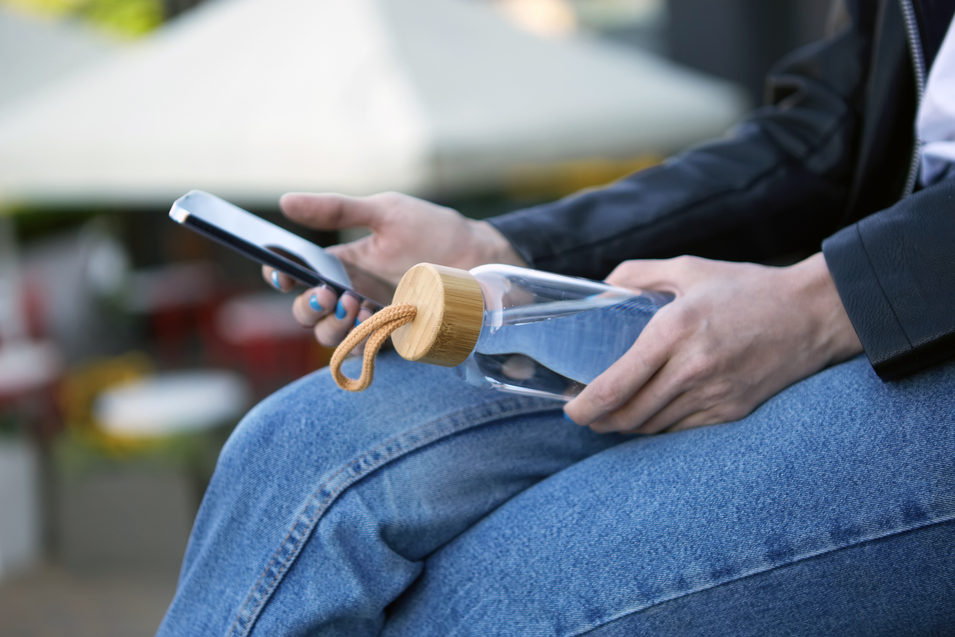 Woman with phone and water bottle.jpg
